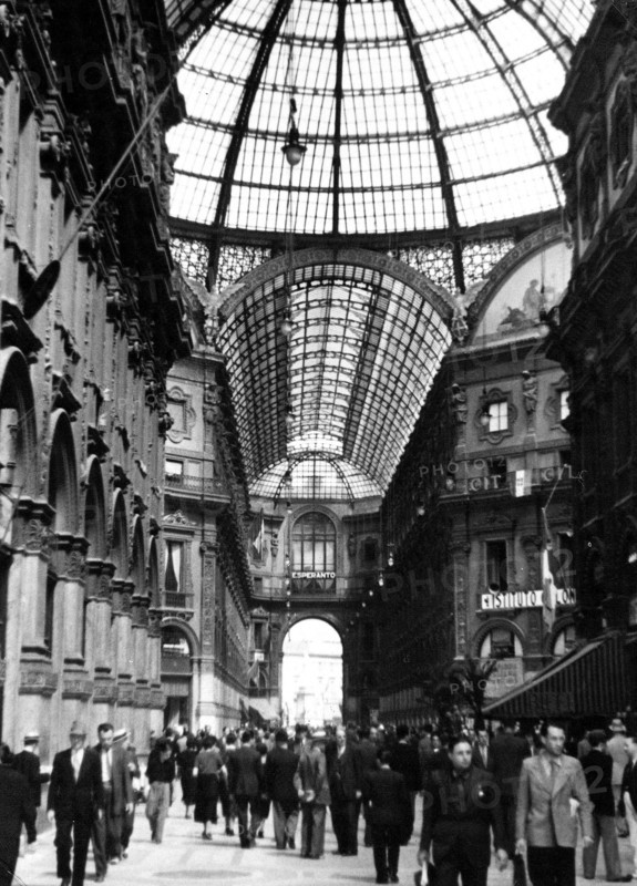 Busy sidewalk scene in Milan Italy