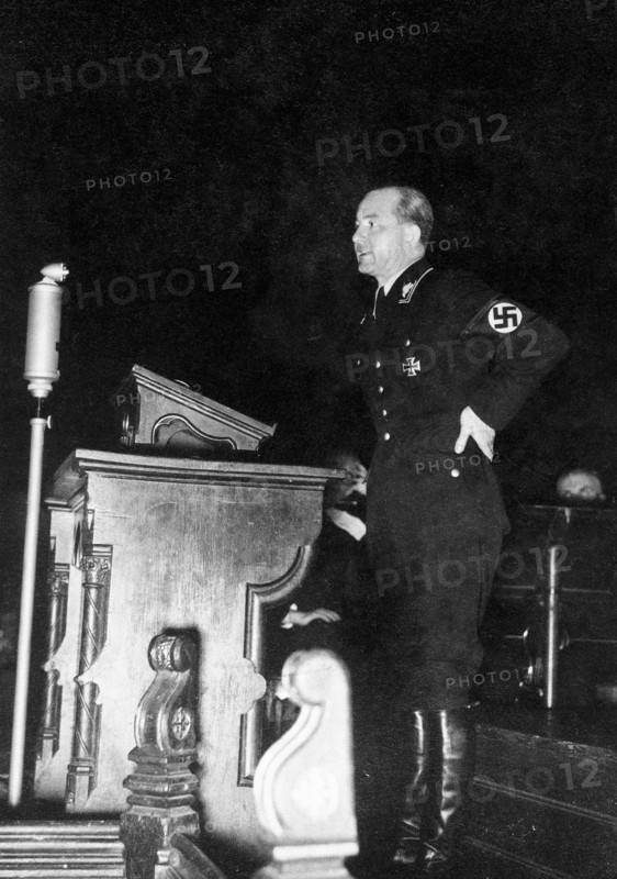 Nazi officer standing at what appears to be a church lectern