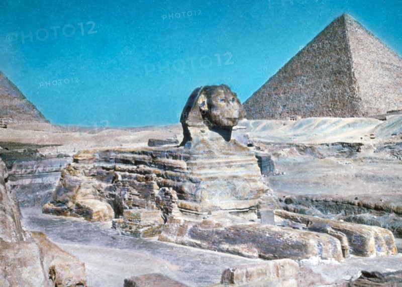 Original Caption:  Cairo and the pyramids