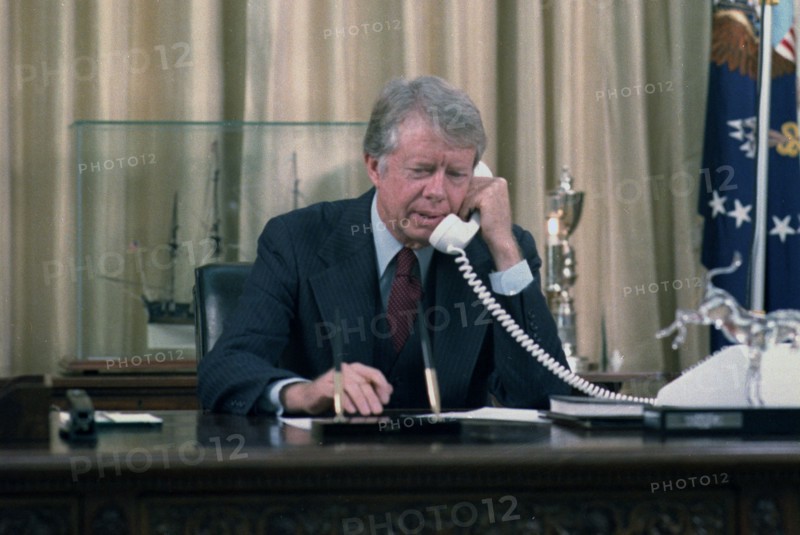 Jimmy Carter on the telephone in the oval office