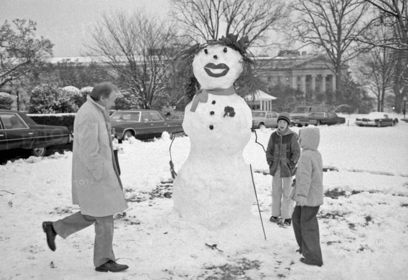 President Carter views snowman built by Amy Carter and her friends.