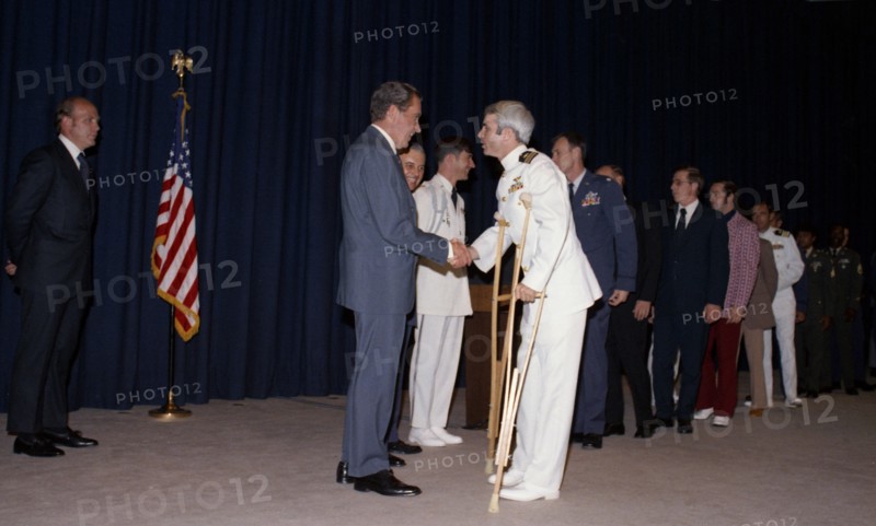 John McCain greeted by Richard Nixon.