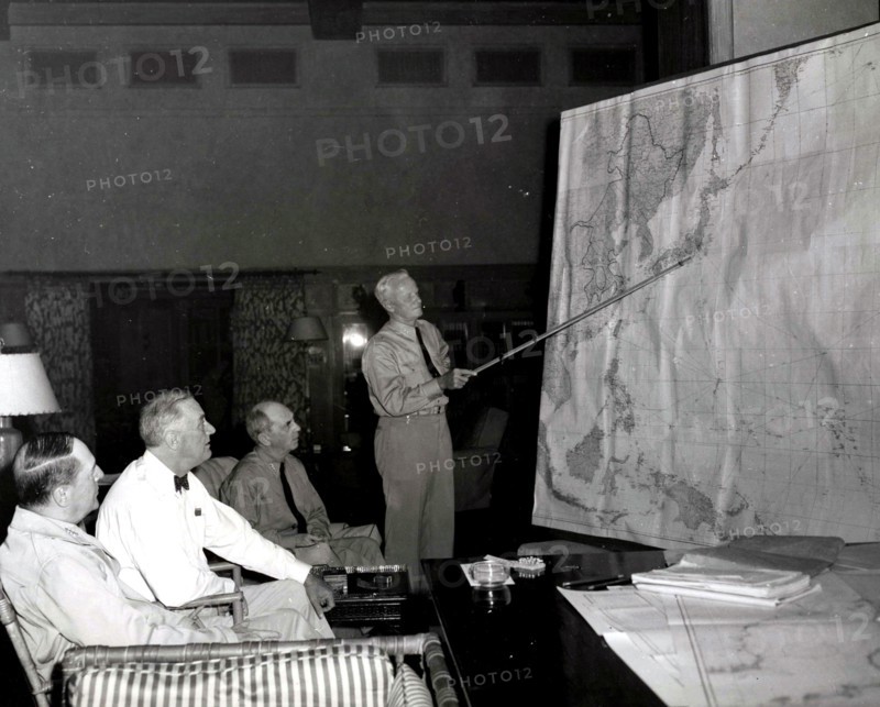 Admiral Chester Nimitz confers with President Roosevelt and officers