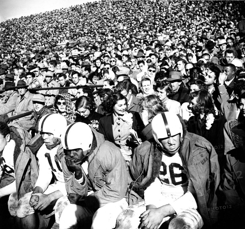 View of Football Crowd and Players on Bench