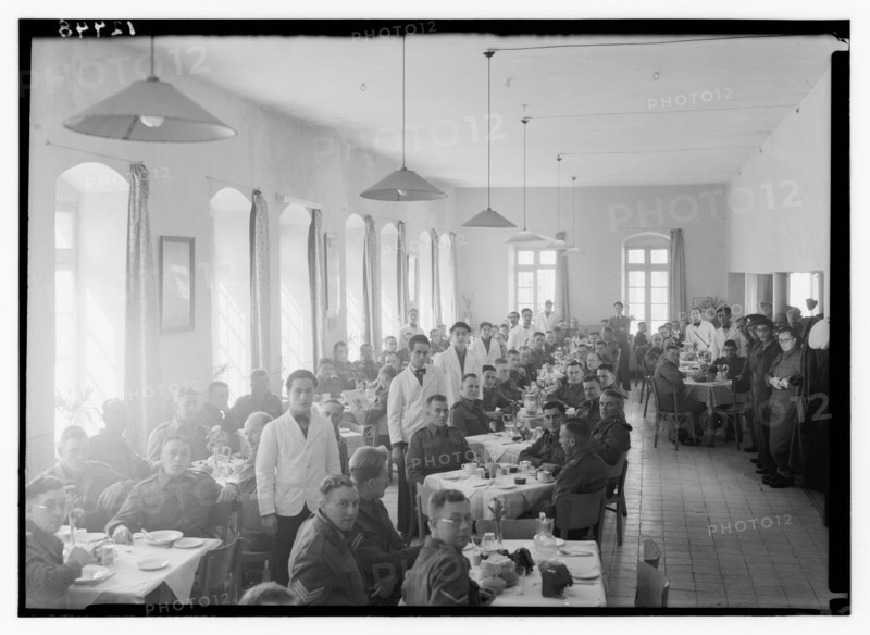 Service men and wait staff or watiers in the dining hall at YMCA hostel (old post office) ca. between 1940 and 1946