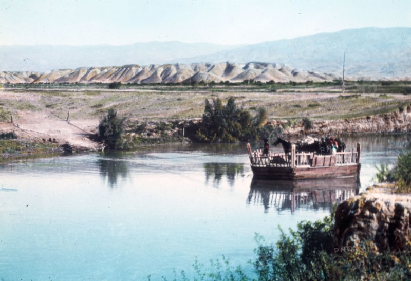 A ferry on the River Jordan, carrying horses ca. between 1950 and 1977