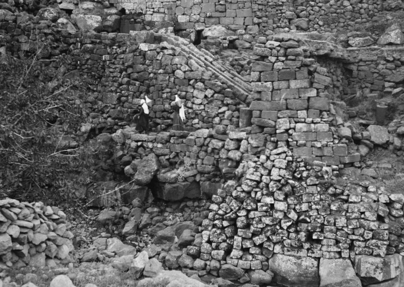 Women carrying water jars in Kanawat among Roman runways for water mills ca. 1938