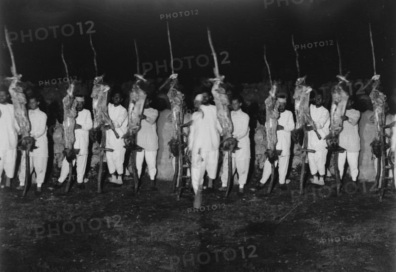The Samaritan Passover on Mt. Gerizim, Samaritan men with prepared carcasses ready for the oven. ca. 1900
