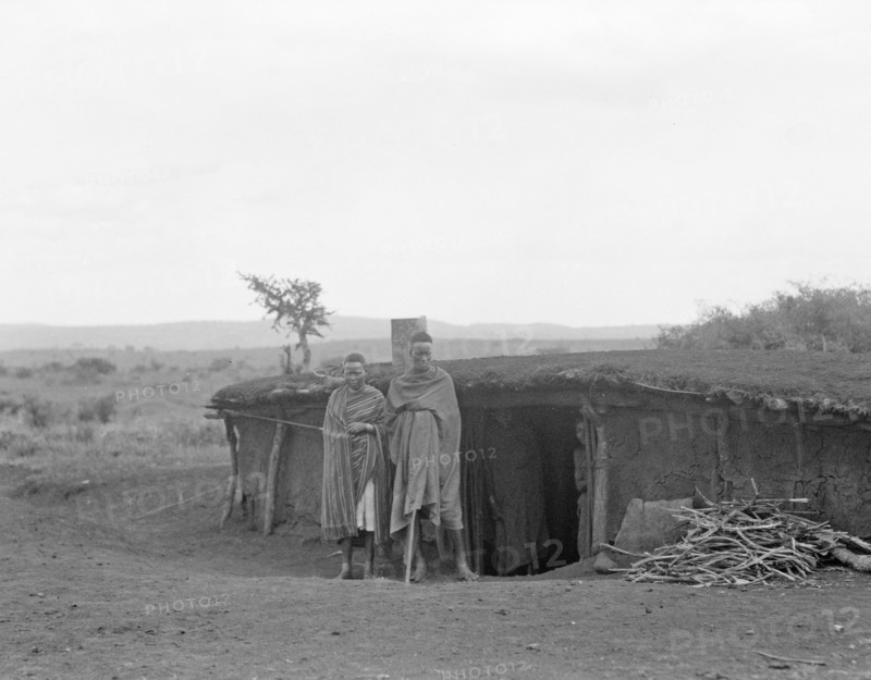 Semi subterranean dwellers, (man and woman?) living in Namanga Kenya, on the game reserve ca. 1936