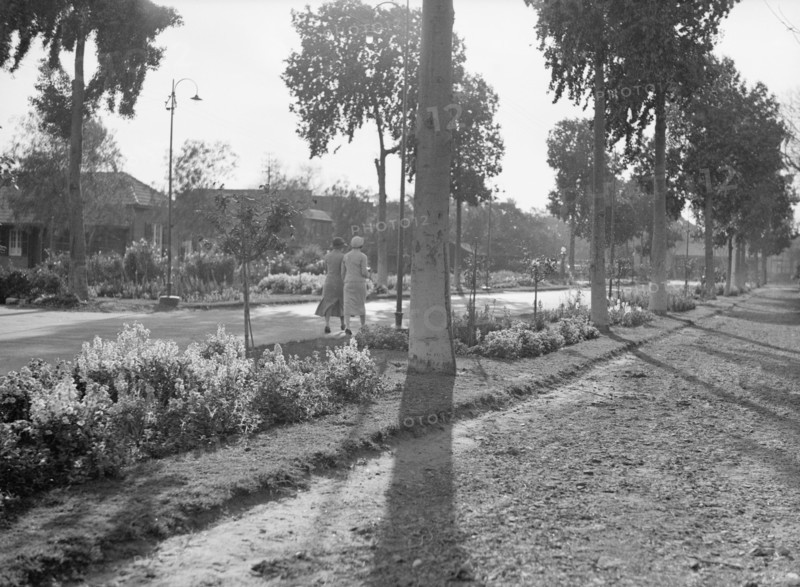 Two women walking at the Gezira Gardens & sports club ca. between 1934 and 1939