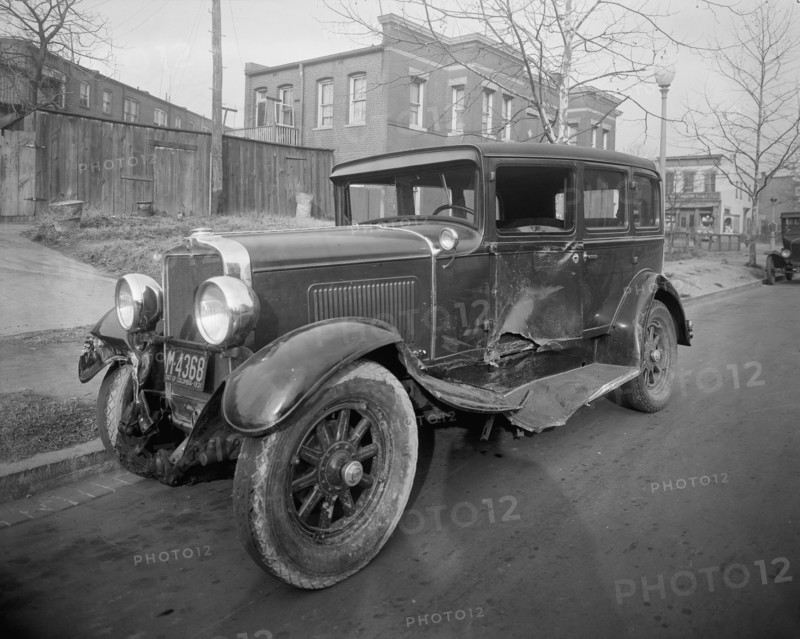 Close up of a car involved in an auto accident ca. early 20th century