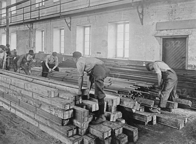 Early 20th century men working with lumber ca.  between 1910 and 1926