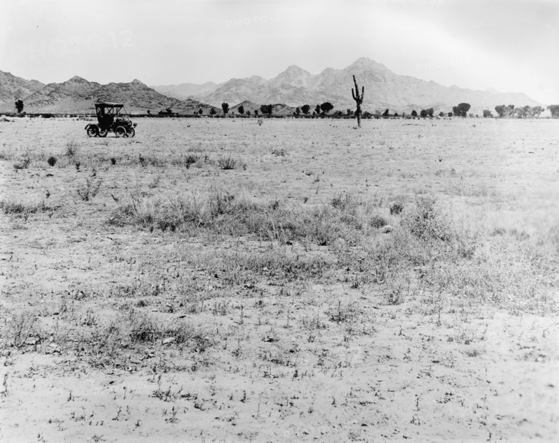 Early 20th century car traversing through the desert ca.  between 1910 and 1935