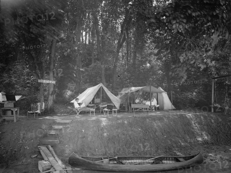 Summer camps: Canoe and campers at Tak it Ezy camp ca.  between 1910 and 1935