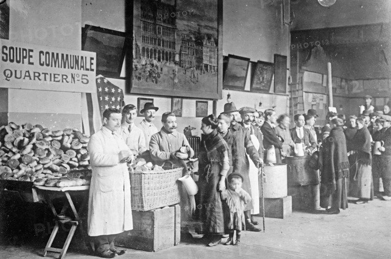 Giving out the day's rations of food to refugees in Belgium. ca.  between 1910 and 1920