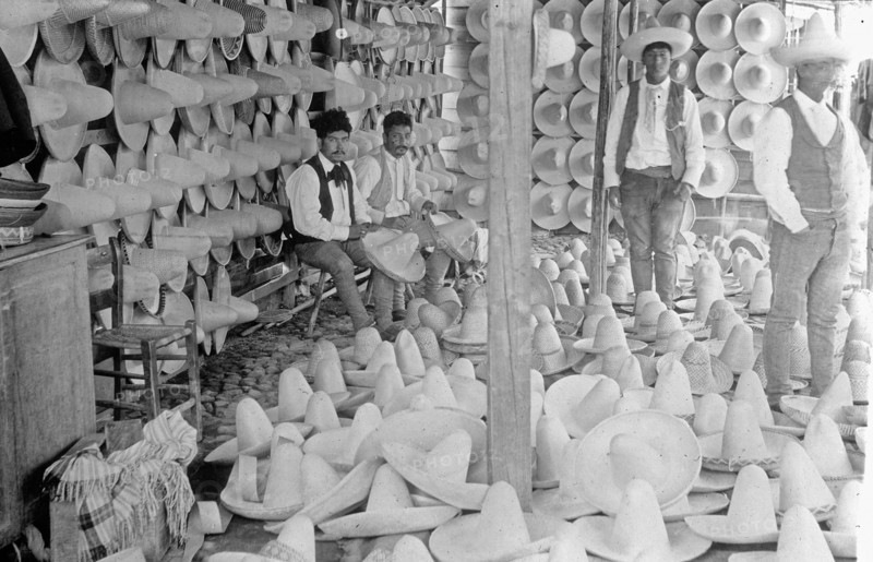 Men selling MexiCompany Sombreros in Market place, Mexico City ca.  between 1909 and 1920