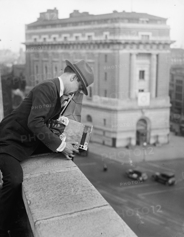 Unidentified photographer with camera ca. between 1909 and 1923