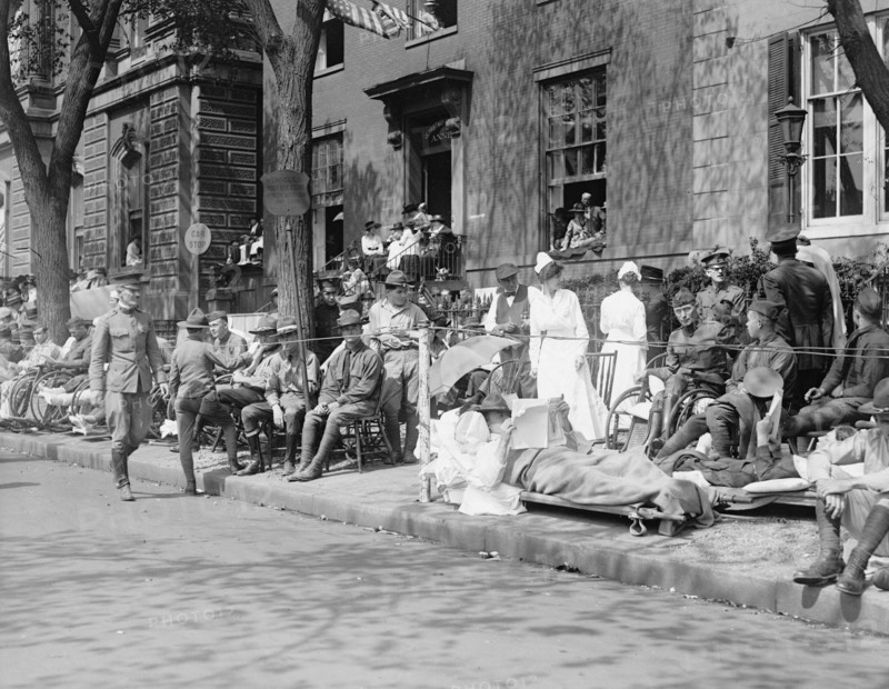 Men, women and children watching the Pershing parade ca. between 1909 and 1923