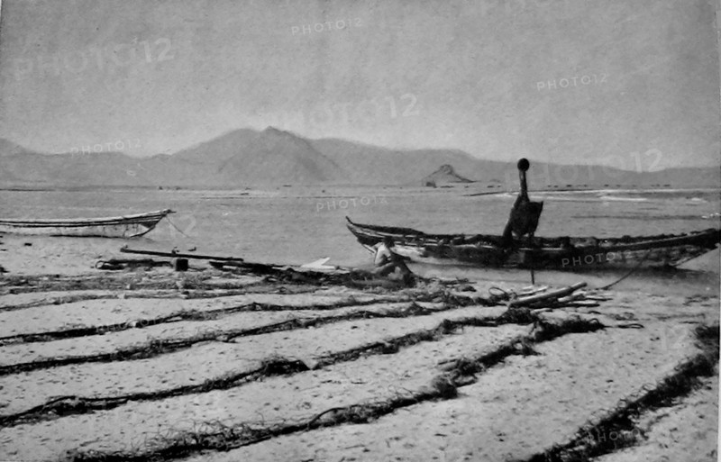 View of  Khor Ghorera (Yemen) in January 1914. Also known as the lagoon, or lake, of Sheikh Said. Several huts are visible across the lake. A  small Turkish garrison occupied Fort Turba at the top of a promontory nearby.