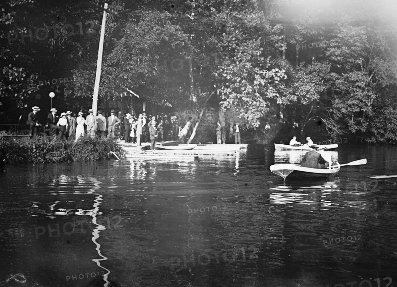 Men rowing boats on the C&O Canal ca. between 1909 and 1919