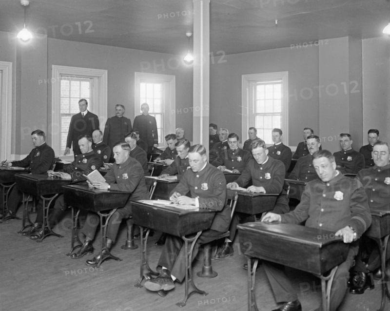 Cadets studying in a classroom at Police School ca. between 1909 and 1940