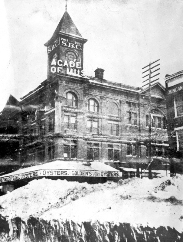 Snow pile & St., Washington., D.C outside the Academy of Music building, ca. between 1909 and 1940
