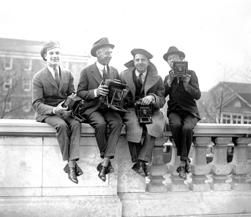 Four Unidentified photographers with cameras ca. between 1909 and 1923