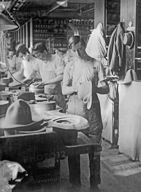 Men working at the Stetson Hat Company manufacturing soft army hats ca. between 1909 and 1920