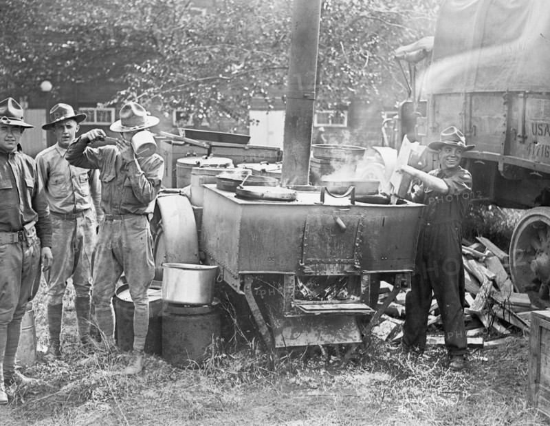 Soldiers cooking food at a army field kitchen, 1st Division boys ca. between 1909 and 1932