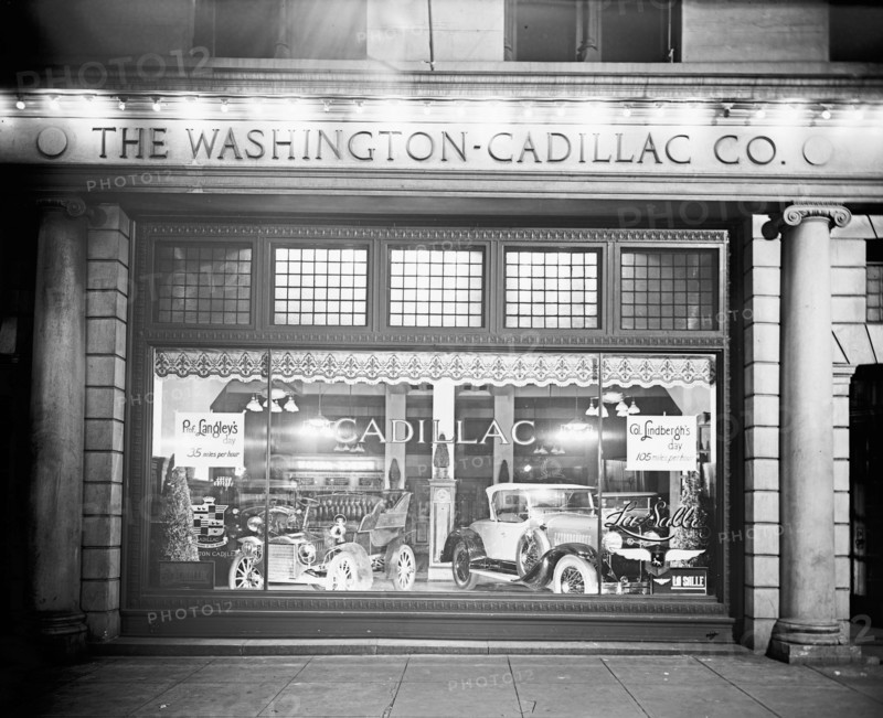 Cadillac Motor Company showroom window at night ca.  between 1918 and 1928