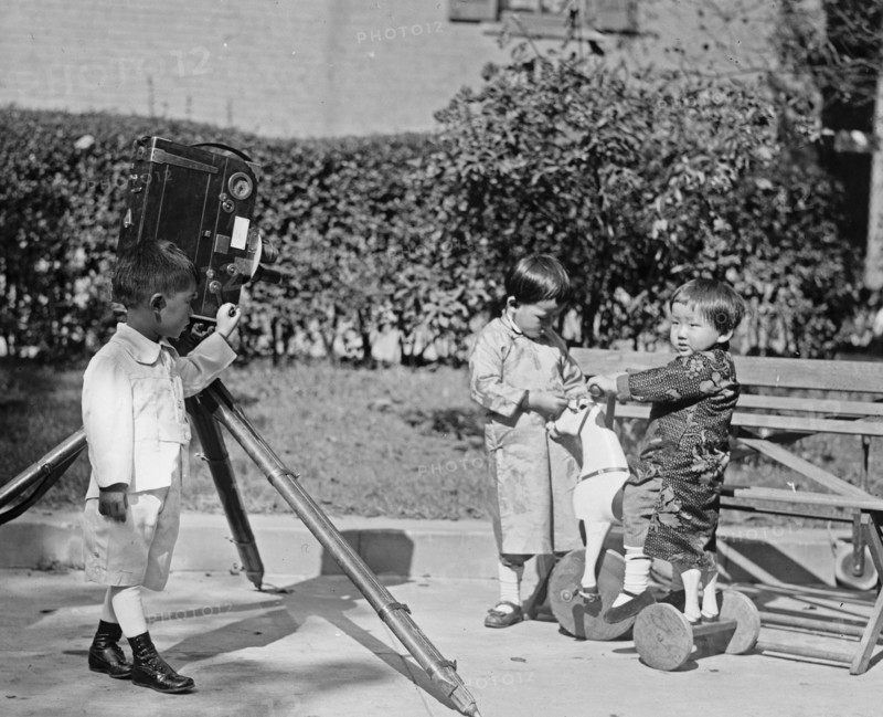 Koo & Sze children, one child looks to be operating a movie camera ca.  between 1918 and 1920