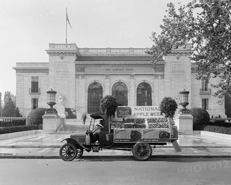 National Apple Week Association float [Pan American Union, Washington, D.C. in background] ca.  between 1918 and 1928