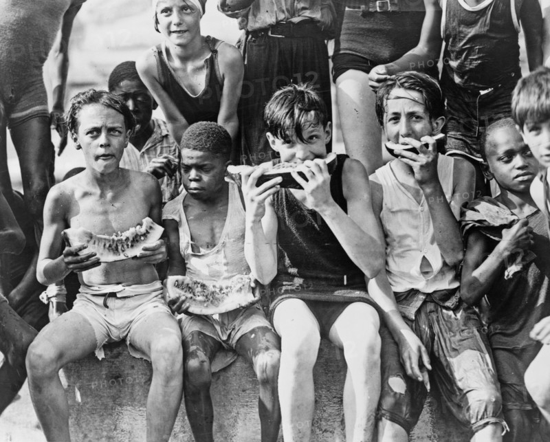 Young kids eating watermelon ca. 1909