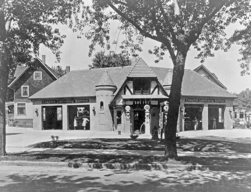 Mechanics working on cars inside a service station, Washington, D.C. area ca. 1909