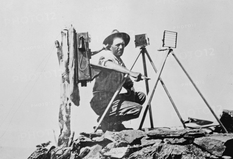 Signal station in the Rockies, showing telephone installation and signal man using heliograph ca. 1909