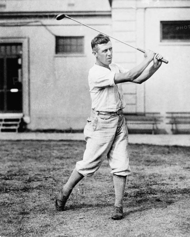 Man swinging golf club in the Washington, D.C., area ca. 1909