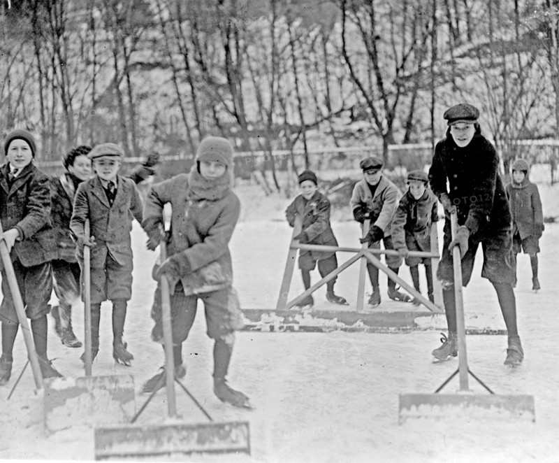 Boys cleaning snow off the ice, so that they can ice skate, Washington, D.C., area ca. 1909