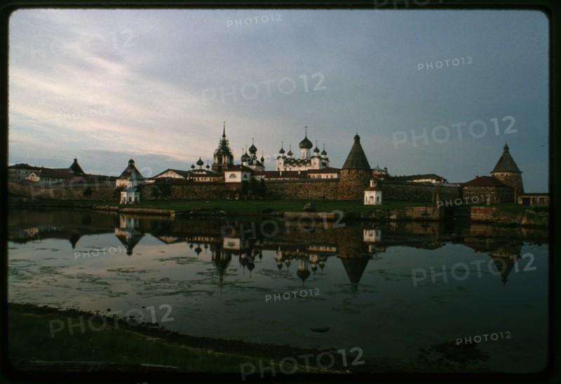 Monastery of the Transfiguration of the Savior (16th-19th centuries), southwest view across Bay of Felicity, evening, after storm, Solovetskii Island, Russia; 1999