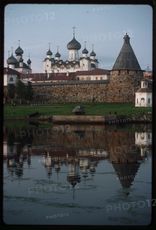 Monastery, Cathedral of the Transfiguration of the Savior (1558-1566), Church of St. Nicholas (1832-1834), (left), and Chapel of St. Peter (mid 19th century), southwest view across Bay of Felicity, Solovetskii Island, Russia; 1999