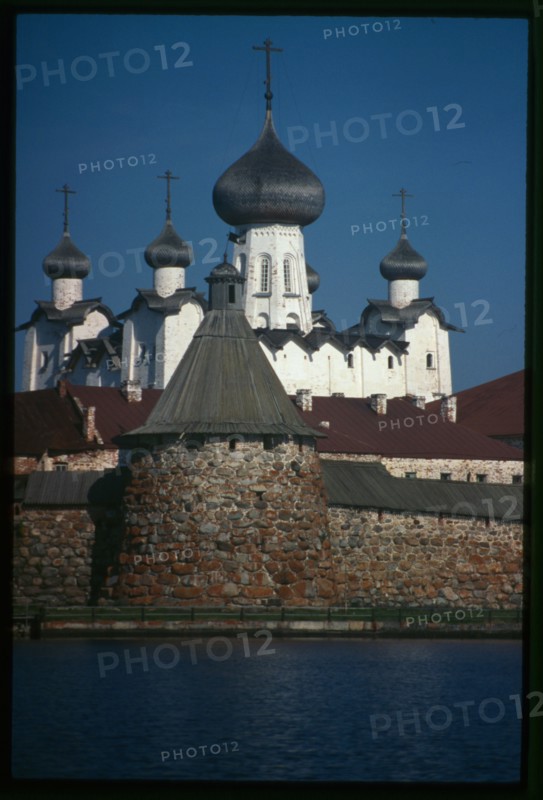 Monastery, Cathedral of the Transfiguration of the Savior (1558-1566), Priadil'naia (Spinning) Tower (late 16th century), southwest view across Bay of Felicity, Solovetskii Island, Russia; 1999