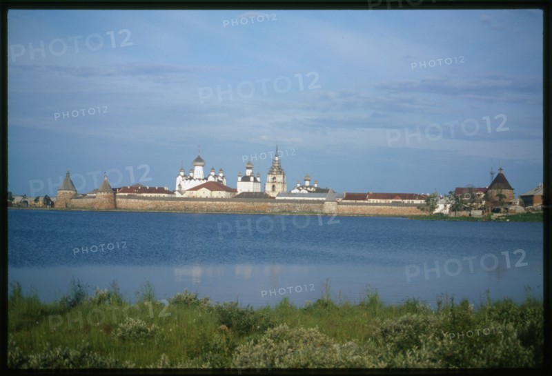 Monastery of the Transfiguration of the Savior (16th-19th centuries), northeast view across Holy Lake, with White Tower (left), Arkhangelsk Tower, and St. Nicholas Tower (right), Solovetskii Island, Russia; 1998