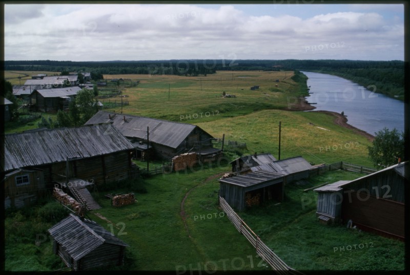 Log houses along Kimzha River, view south, Kimzha, Russia; 2000