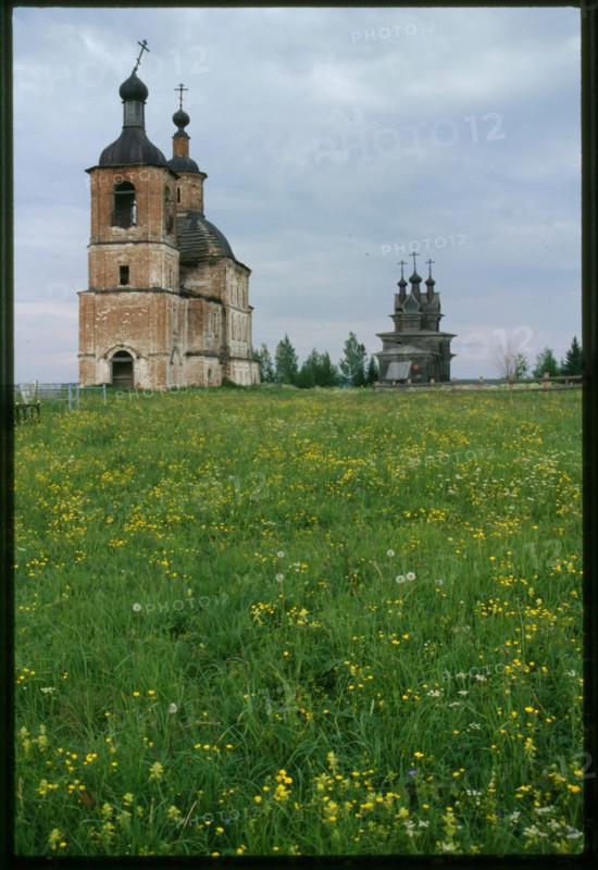Church of Resurrection (1752), and log Church of St. George (1665), southwest view, Permogor'e, Russia; 2000