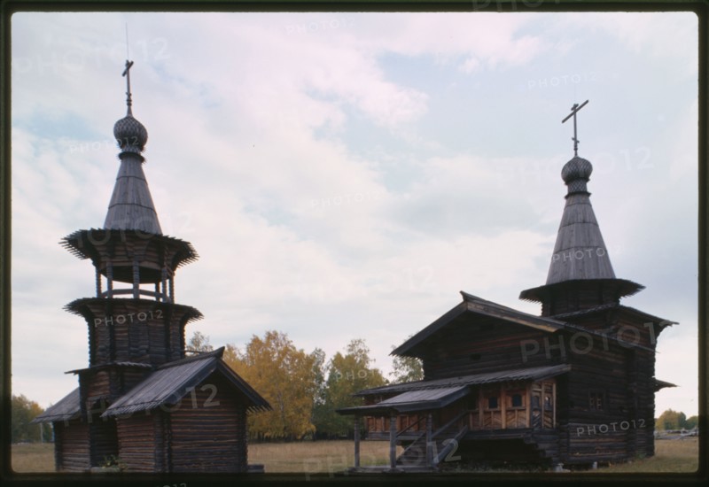 Log Church of the Savior and bell tower from the village of Zashiversk (1700), southwest view, moved and reassembled in the Outdoor Architecture and History Museum at Akademgorodok, Russia 1999.