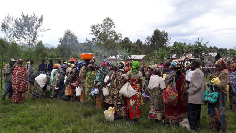 Women in colorful traditional dress wait for relief help during a crisis in North Kivu Cote d’Ivoire (Ivory Coast) ca. 22 March 2017