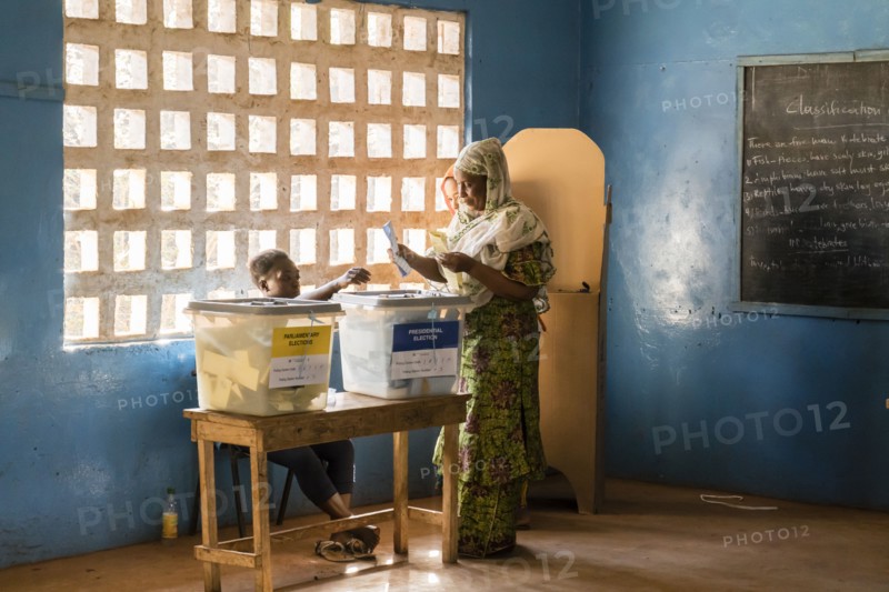 A woman in Sierra Leone casts her ballot in the Sierra Leone presidential election ca. 7 March 2018