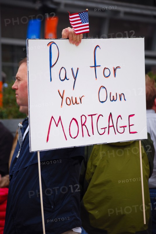 Attendees holding signs at a Tea Party rally in Dallas, TX (one of the first in the United States on Feb. 26 2009)