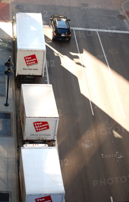 Aerial view of service trucks from the Steam Team, a water damage restoration service