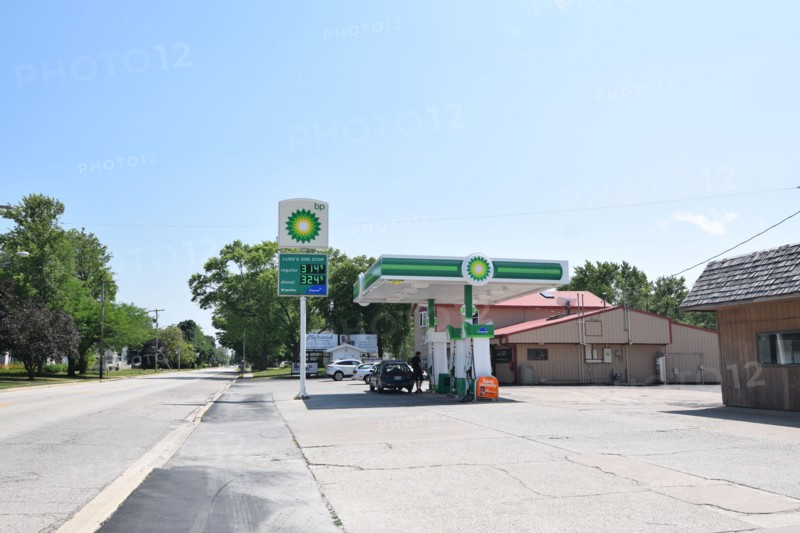 Customers pumping gas at the BP gas station in Cissna Park, Illinois