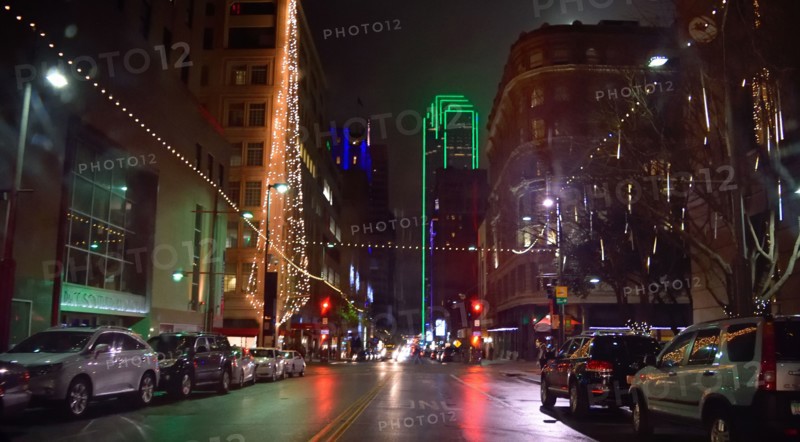 Office buildings and street scene in downtown Dallas at night during the Christmas season